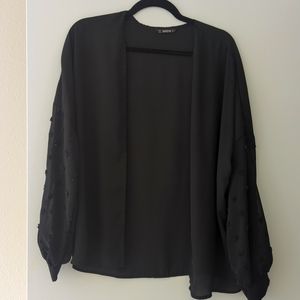 Sheer black throw over